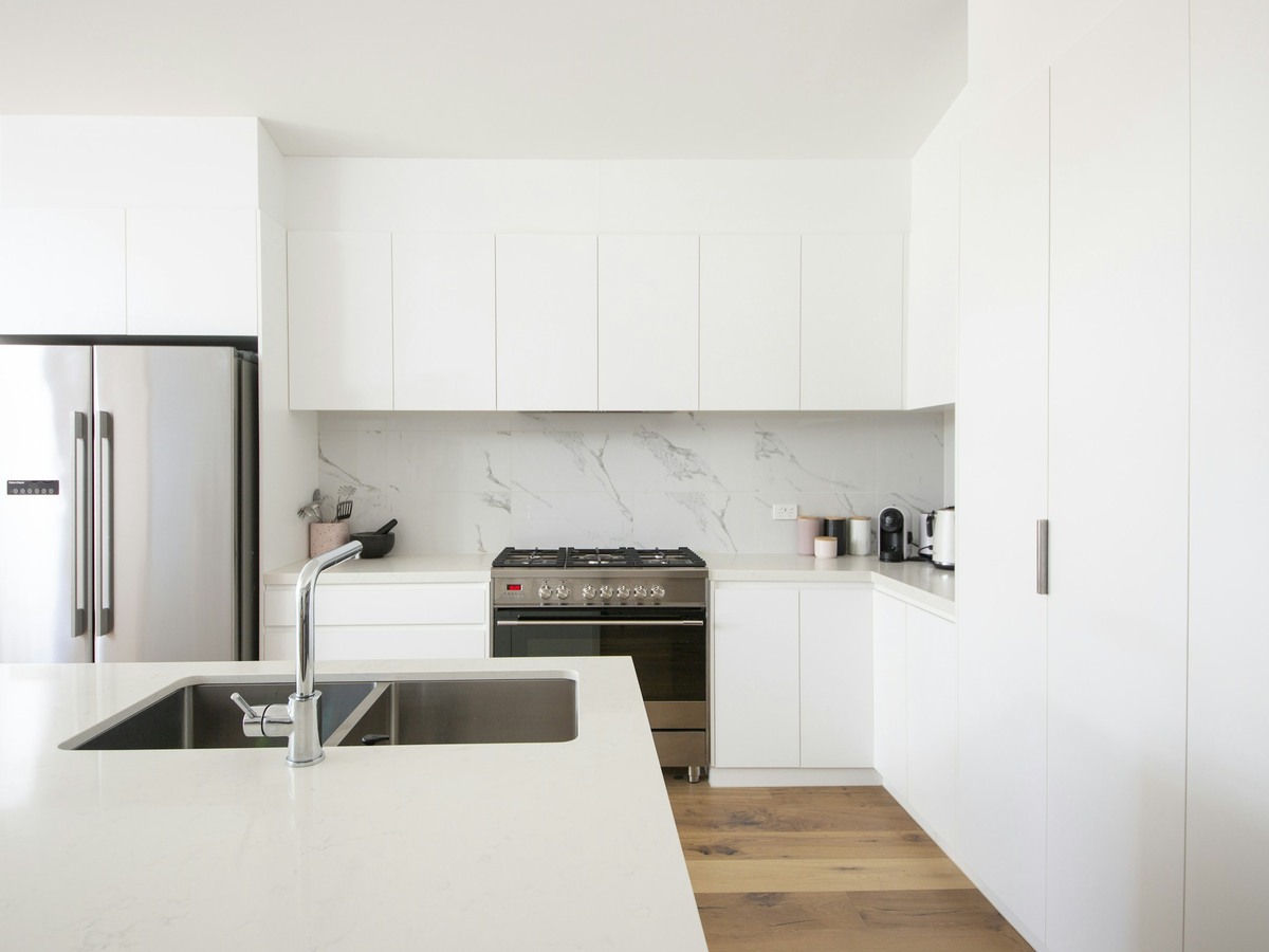 Clean, tidy kitchen bench in a bright home